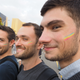 Three men show off the rainbow flags on their face during the 2017 Taipei Gay Pride March on 28 Oct. 2017.